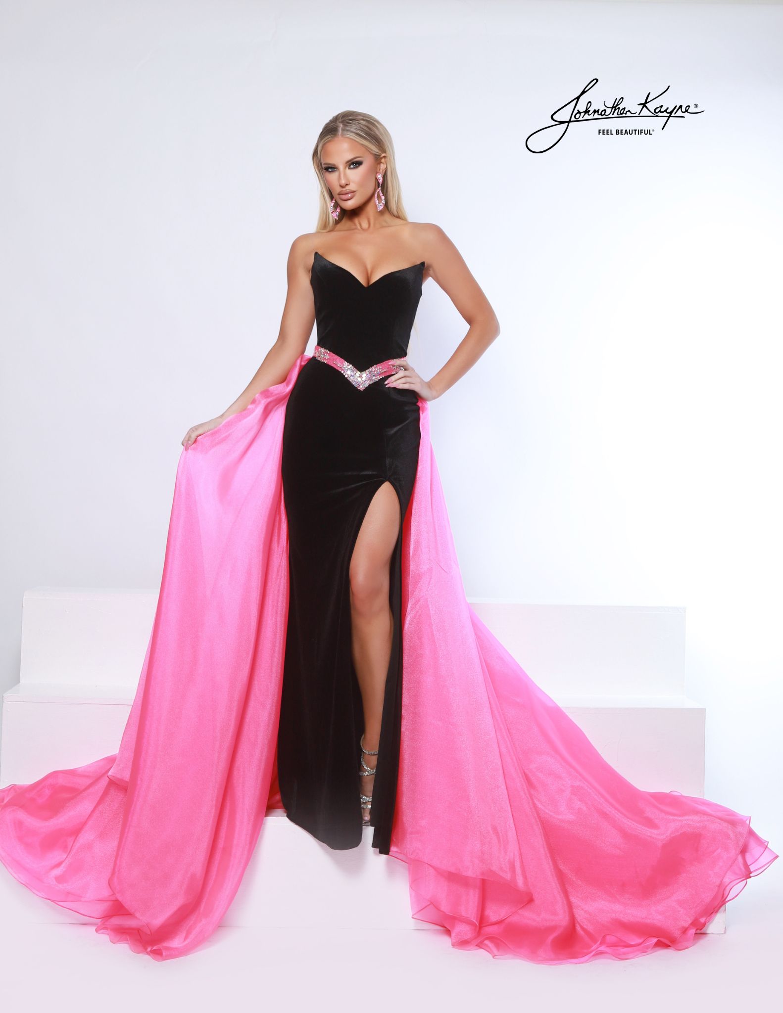 Strapless black velvet pageant gown with hot pink overskirt and crystal belt - ideal for pageants and evening wear competition.